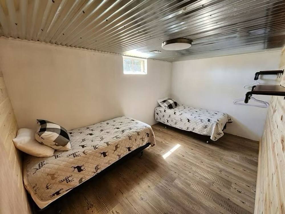 Basement bedroom with twin beds at Cloverdale House