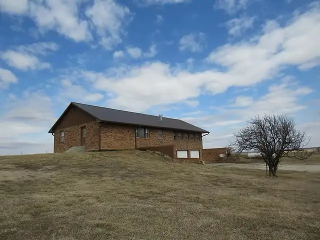 Lake Lodge exterior under an open Kansas sky