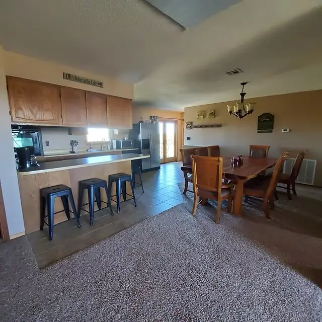 Open-concept kitchen and dining bar at Lake Lodge