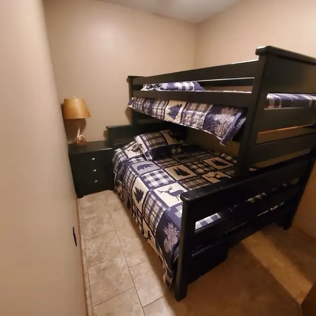 Bunk room with matching quilted bedding