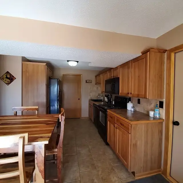 Dining table and kitchen at Lake Lodge